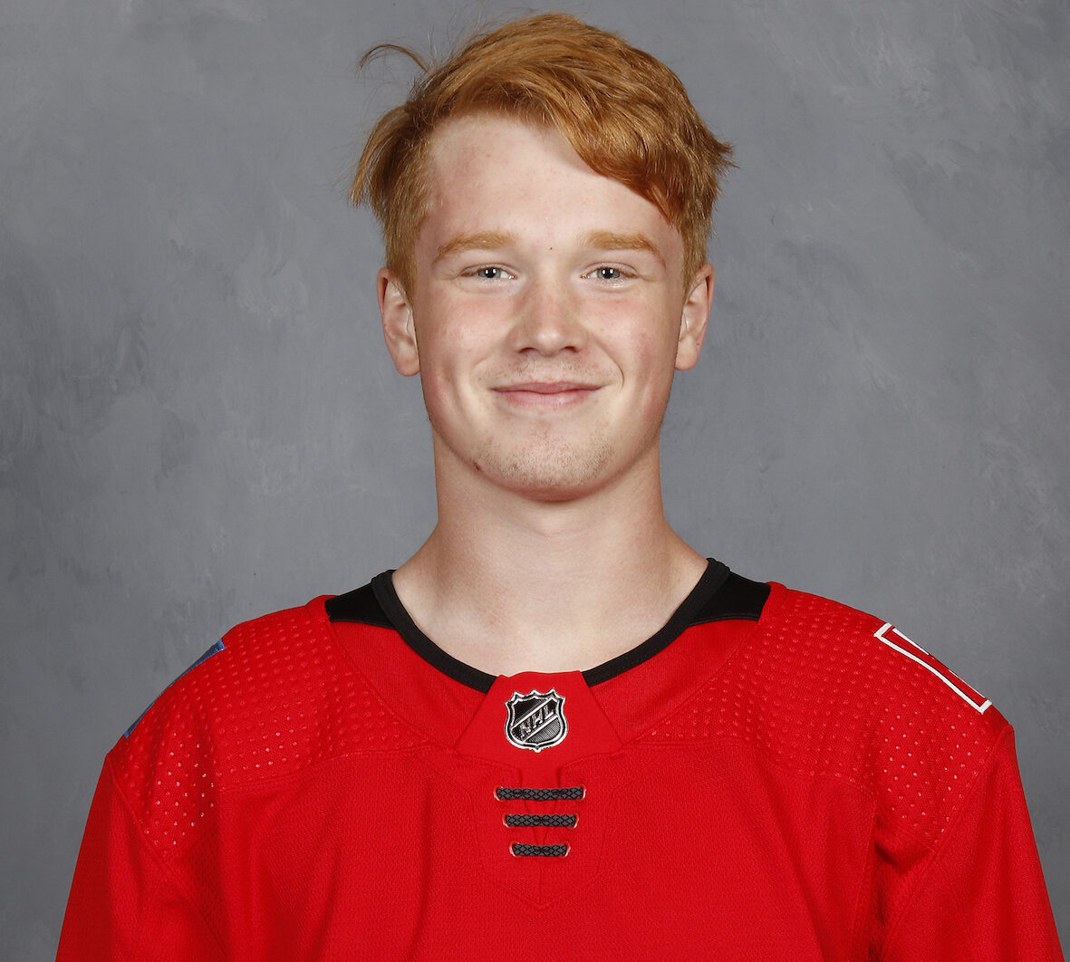 Lucas Feuk of the Calgary Flames poses for his official headshot